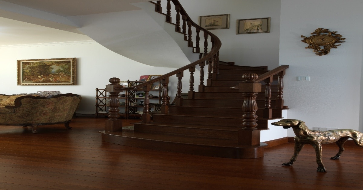 Narrow UK staircase with compact stairlift installed showing slim rail design and measurement guide for tight Victorian-style home stairs