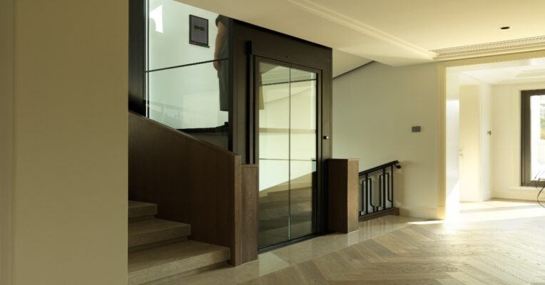 Modern domestic lift installed in a UK home with stylish interior and compact design